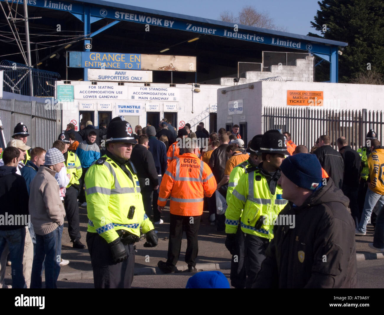 Football fans from Wolverhampton Wanderers being escorted by police into Cardiff City's ground - Ninian Park Stock Photo