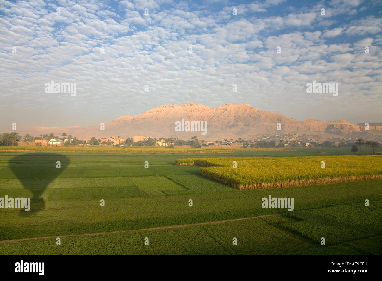 Aerial view of Luxor West Bank Theban Mountains Valley of Kings taken from hot air balloon at dawn sunrise Egypt North Africa Stock Photo