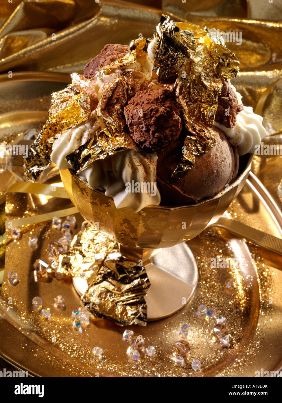 Extravagant gold leaf chocolate truffles and icecream dessert editorial food Stock Photo