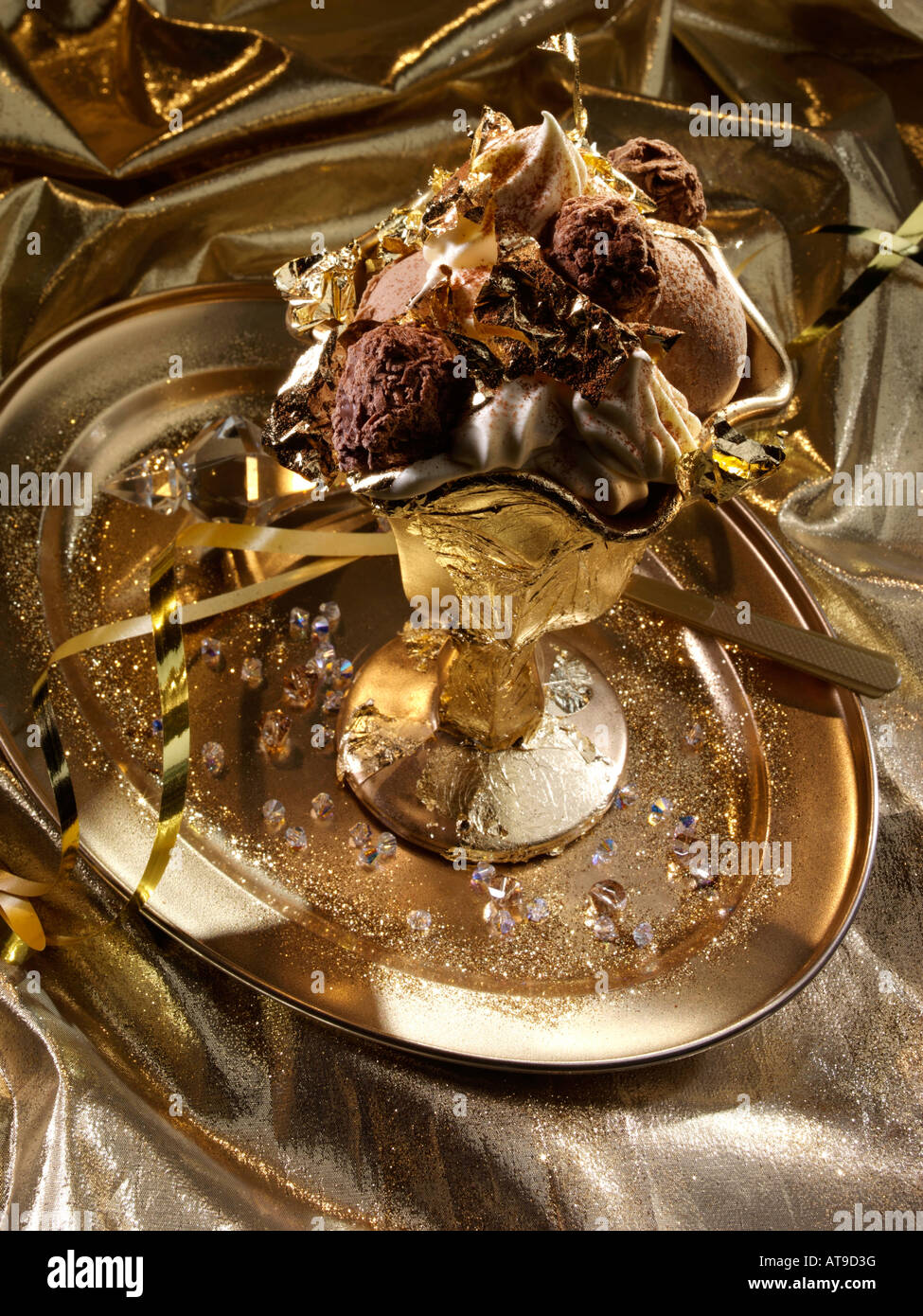 Extravagant gold leaf chocolate truffles and icecream dessert editorial food Stock Photo