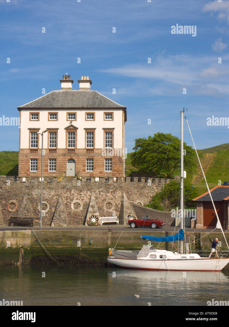 The fishing port of Eyemouth Berwickshire with the 18th century Gunsgreen House and leisure yachting Stock Photo