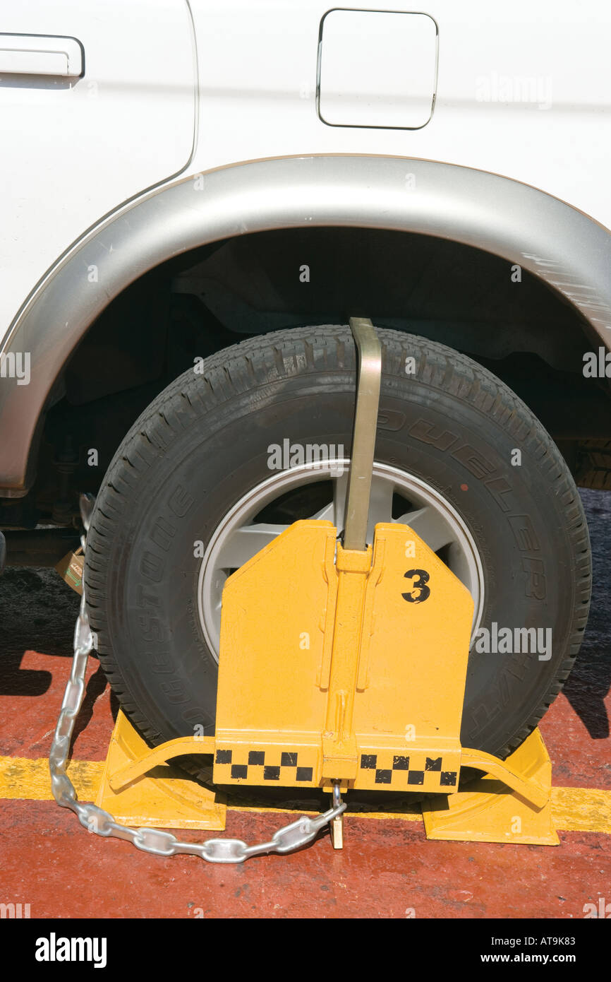Vehicle clamped for illegal parking Stock Photo Alamy