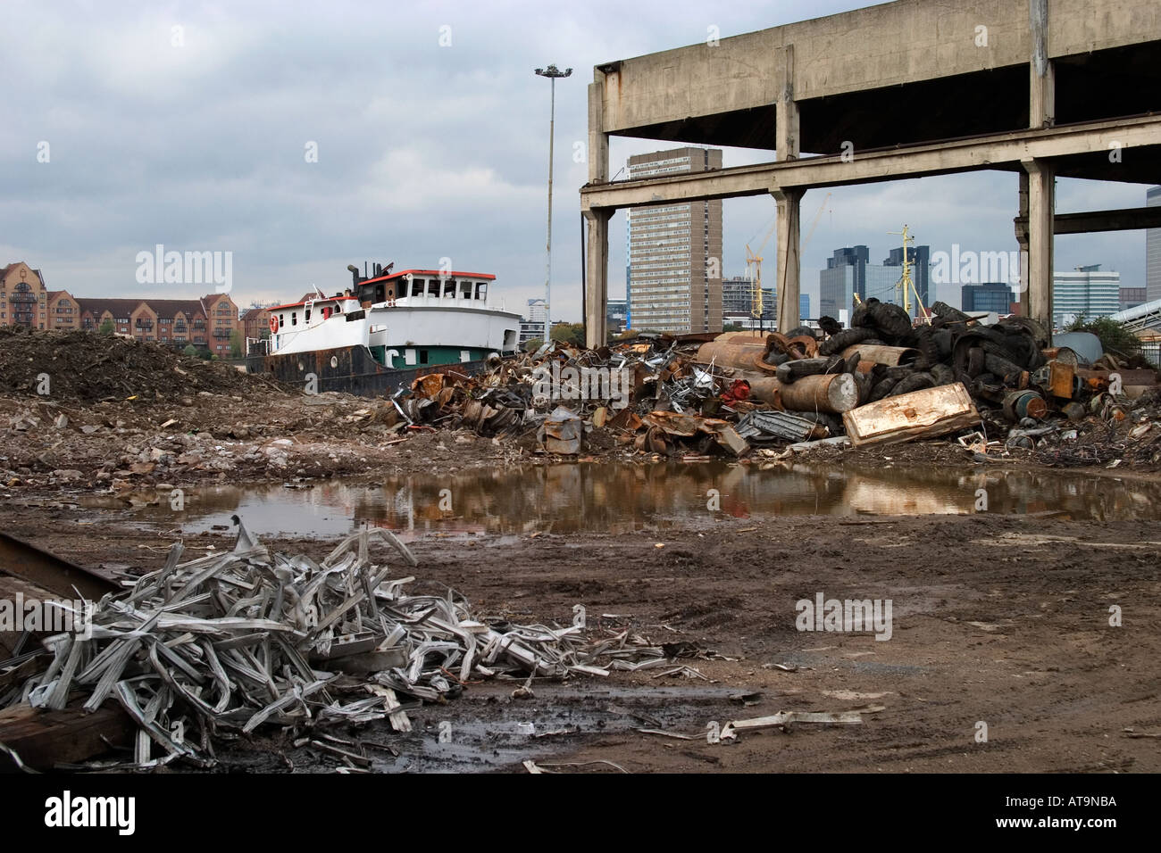 Wrecking yard and rubbish. Thames Path, North Greenwich, London, England Stock Photo