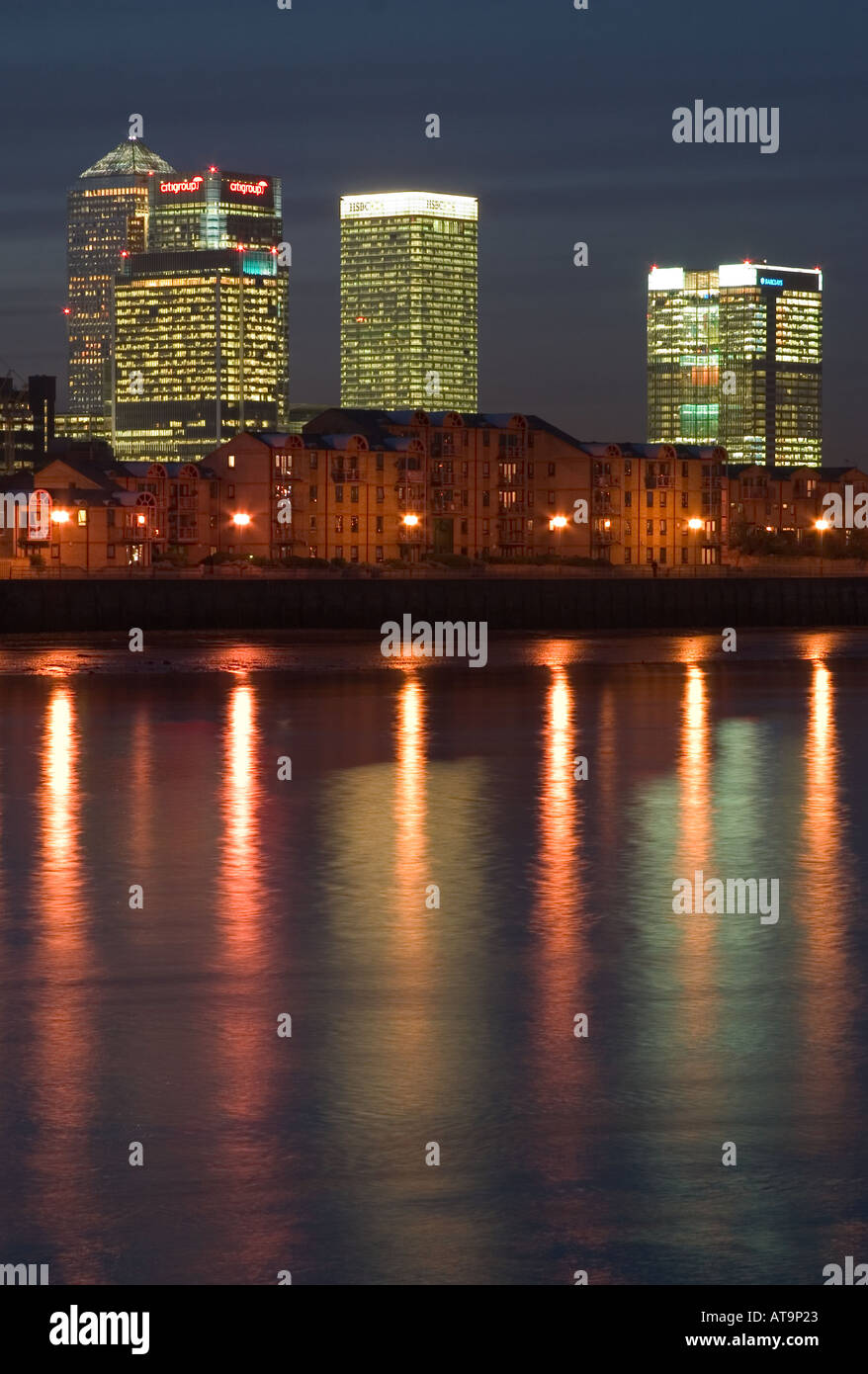 Canary Wharf and docklands waterfront housing reflections seen in ...
