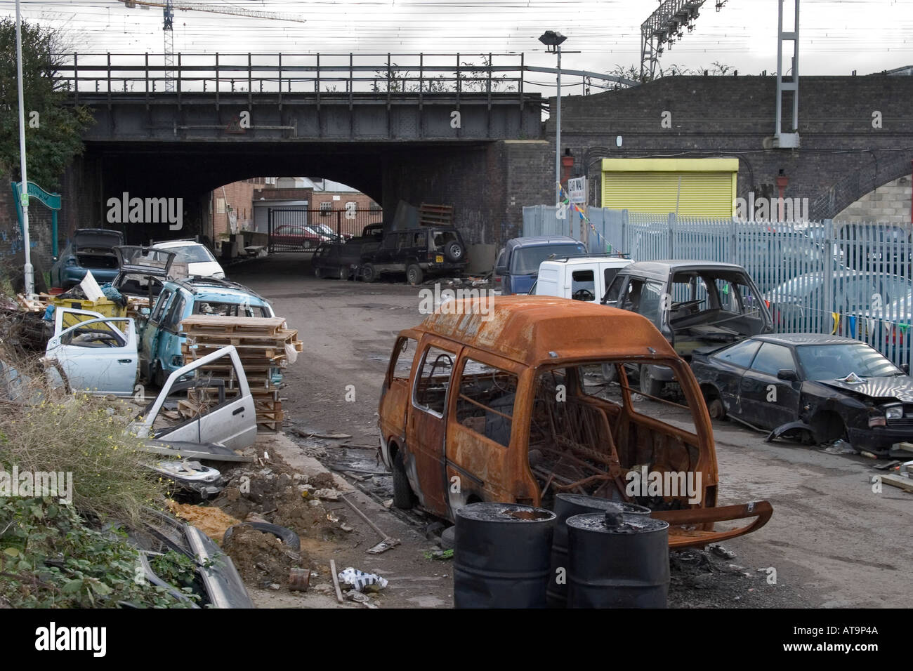 Abandoned wrecked cars and rubbish. Marshgate Lane, Stratford, London
