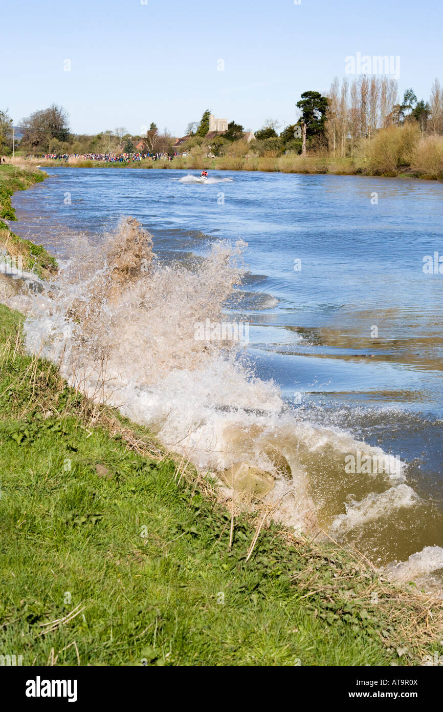 The Severn Bore breaking against the bank of the River Severn at Elmore