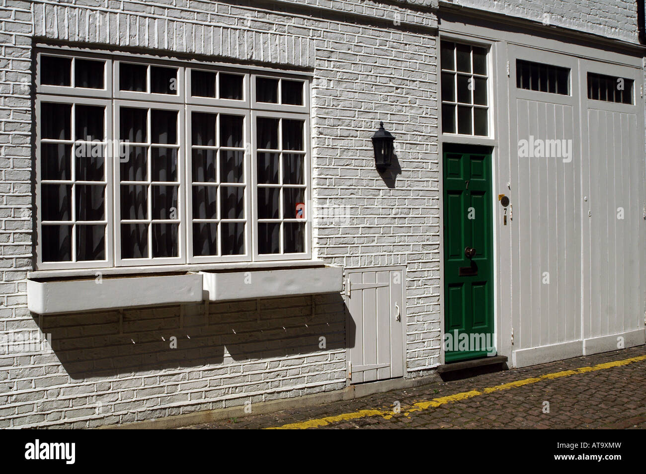 A Row of Brick Buildings with Black Doors on a Street in London Stock Image  - Image of architecture, english: 189002149