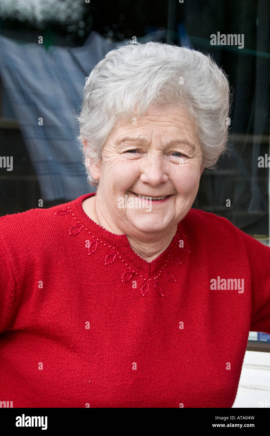 jolly happy smiling Elderly woman pensioner Aberystwyth Wales UK, having had quadruple heart by-pass 10 years ago Stock Photo