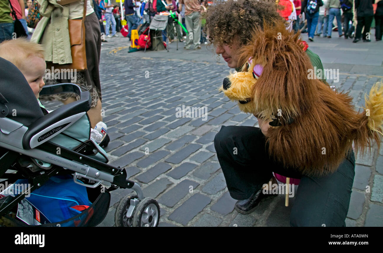 Young baby gazes at hand puppet, Edinburgh Fringe Festival, Scotland, UK, Europe Stock Photo