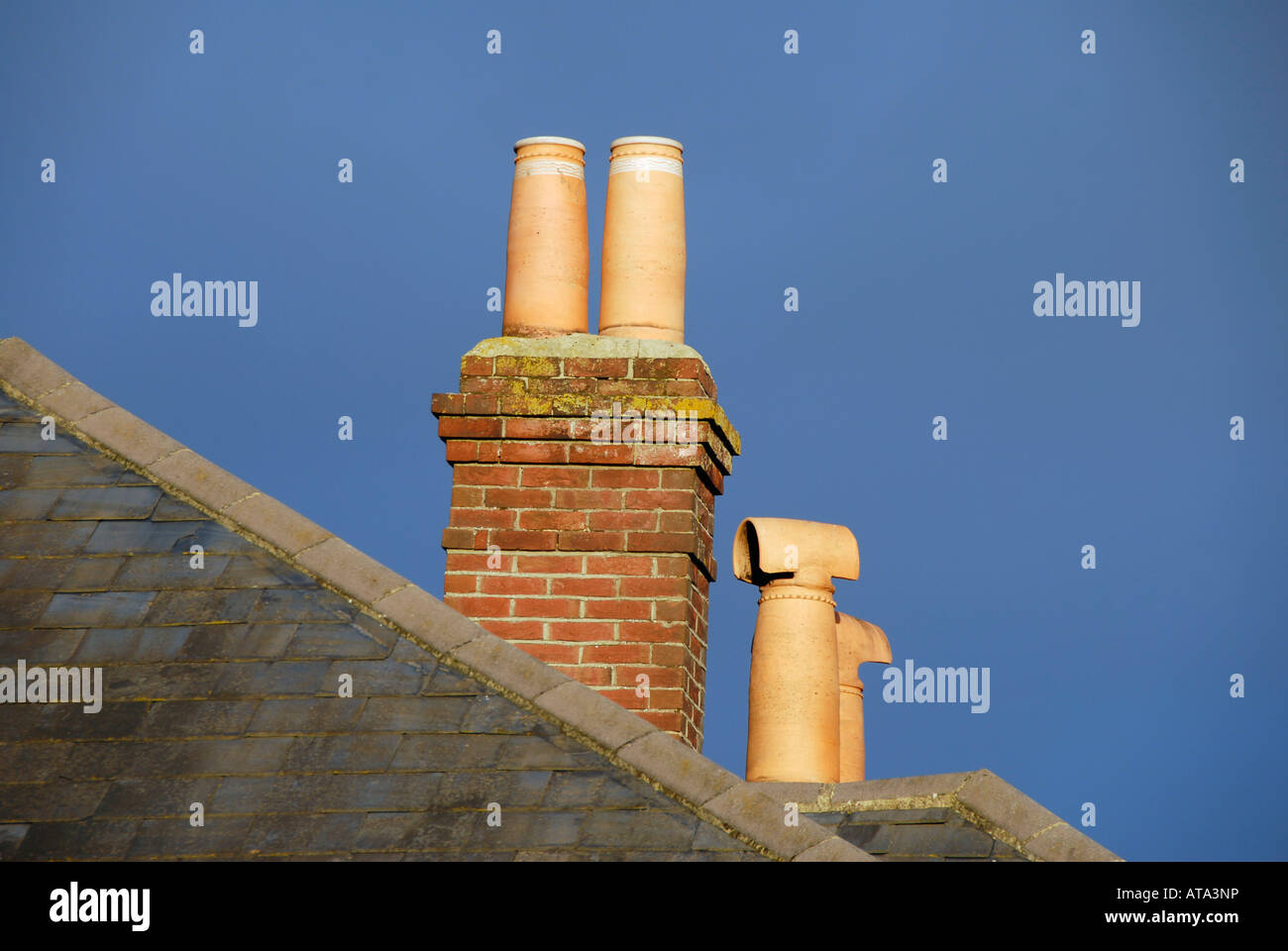 Ornate chimney pots and brick chimney stack Stock Photo Alamy