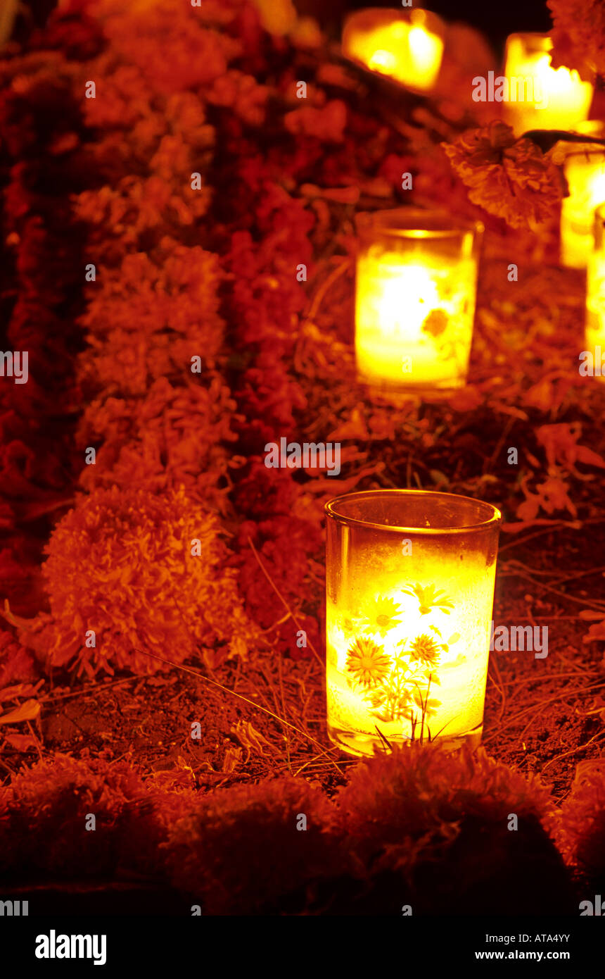 Candles and flowers on grave in the cemetary of Tzintzuntzan near
