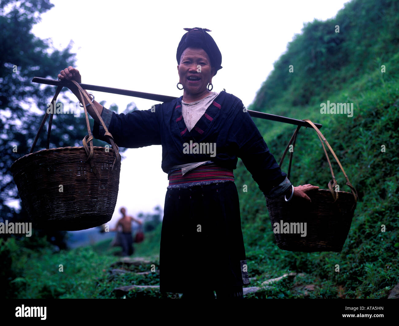 Chinese peasant woman carrying baskets Stock Photo Alamy