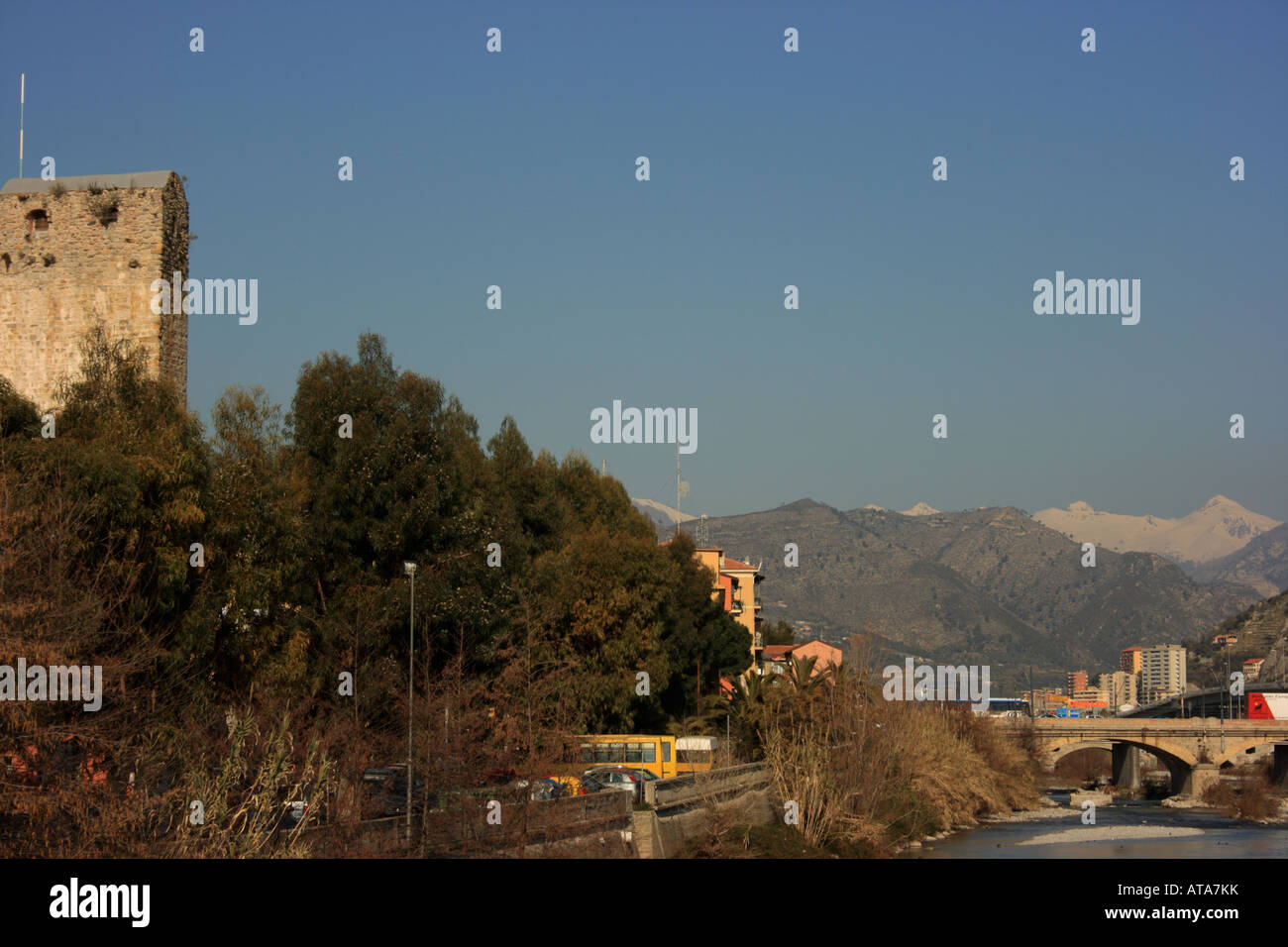 Snow covered mountains and River Roya at Ventimiglia Stock Photo