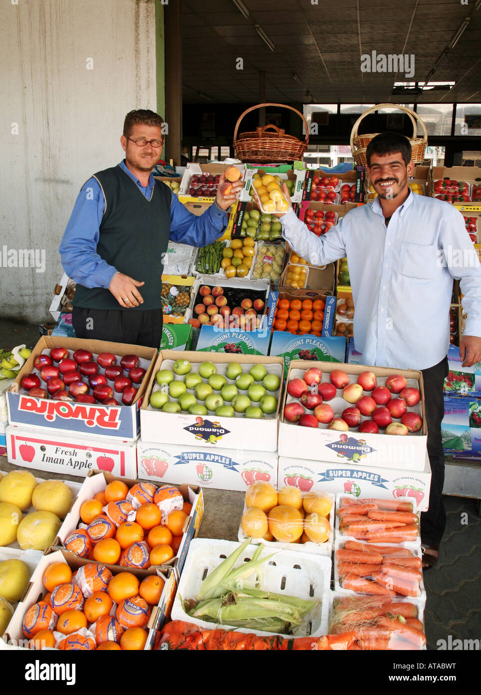 Stall keepers showing off their wares, Fruit and vegetables market, Abu
