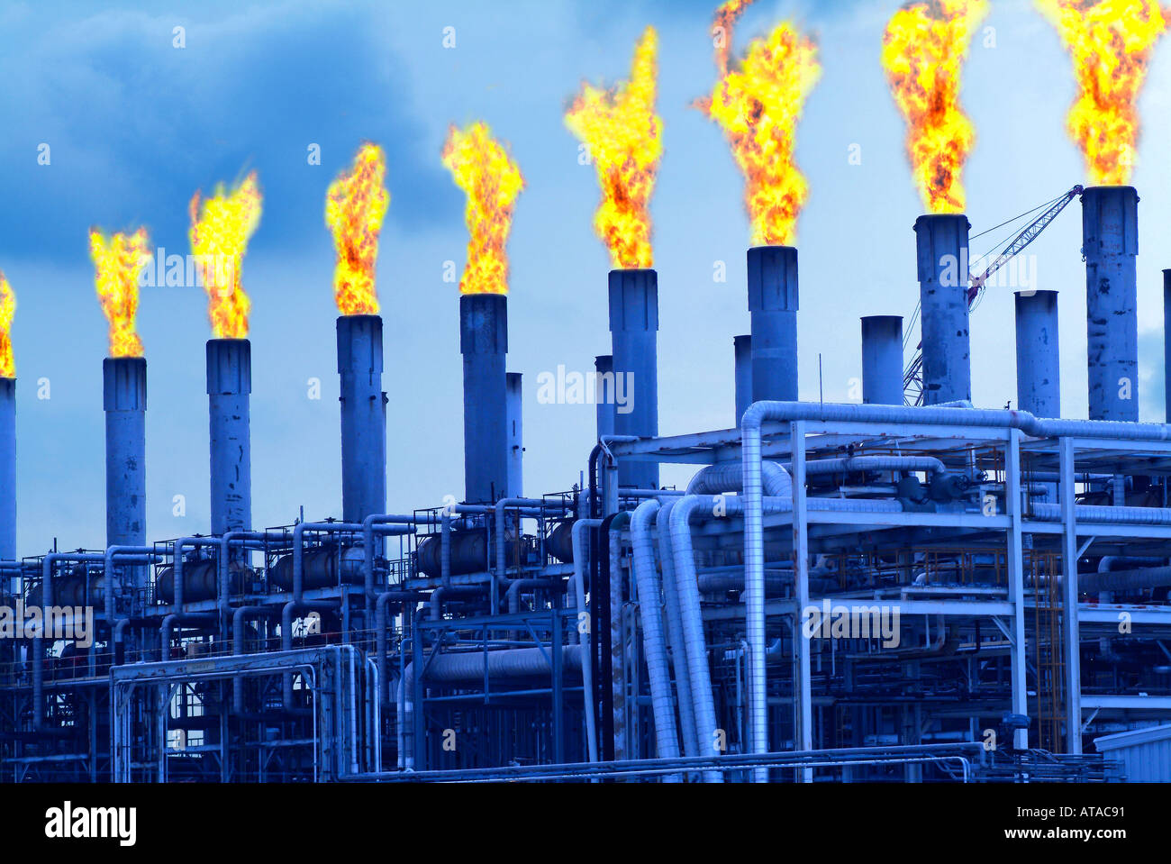Oil refinery showing gas burn off Stock Photo Alamy