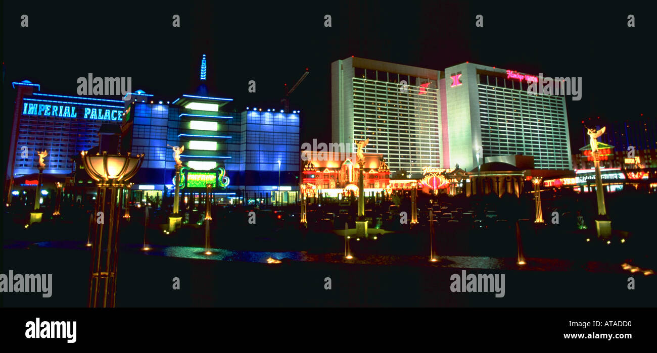 View of the Flamingo Hilton and the Imperial Palace hotels on the Las Vegas strip illuminated at night Stock Photo