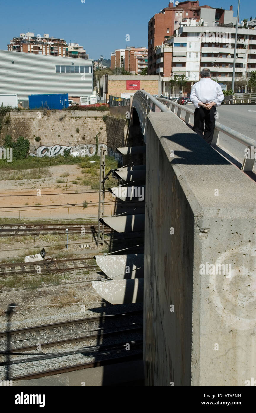 Man walking in a brdge over the railway Stock Photo - Alamy