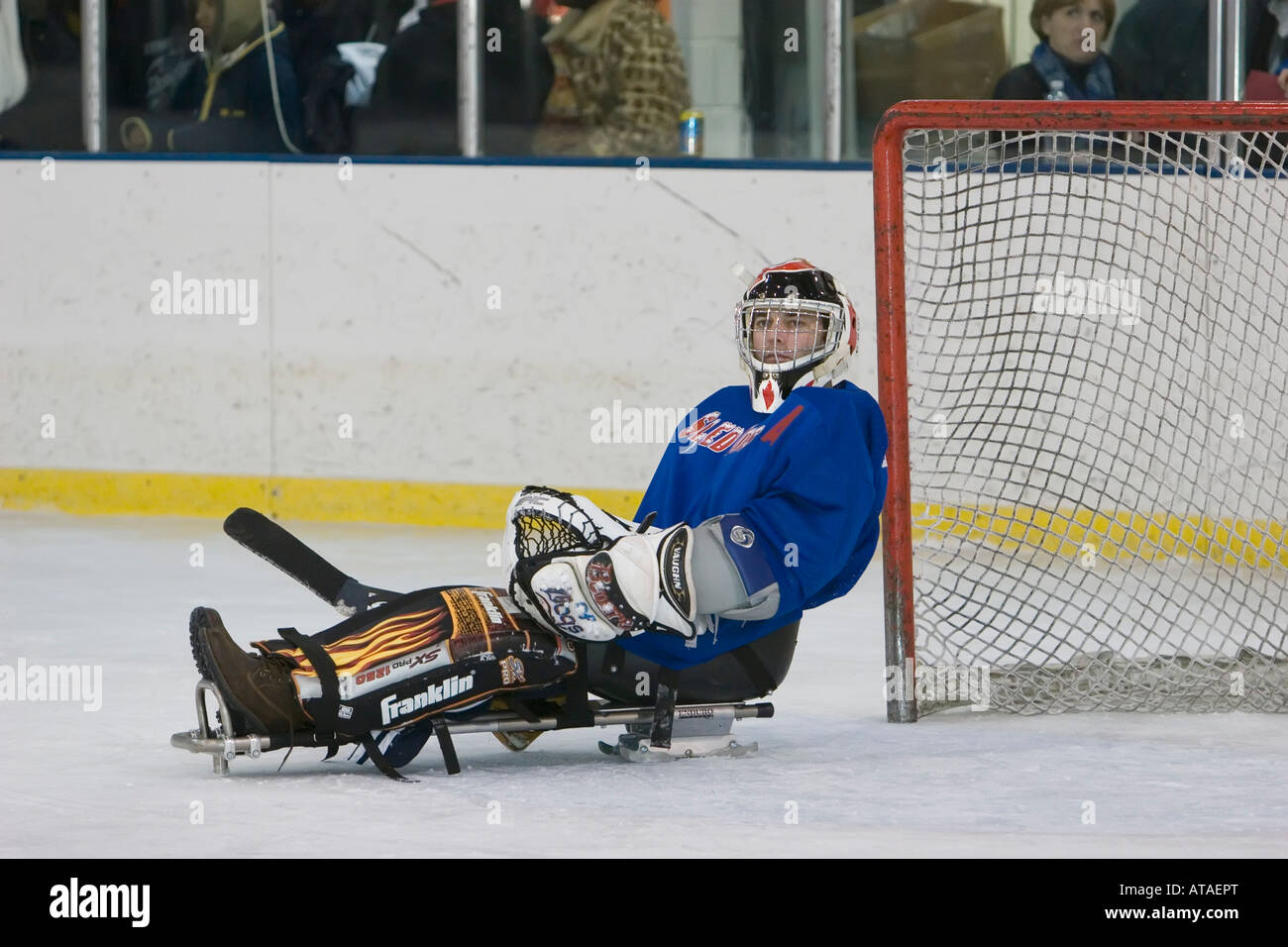 Hockey Goalie in Complete Hockey Outfit Sitting on Office Chair. Above Him  are Lamps with a Light Bulb on. Stock Image - Image of dress, complete:  161355677