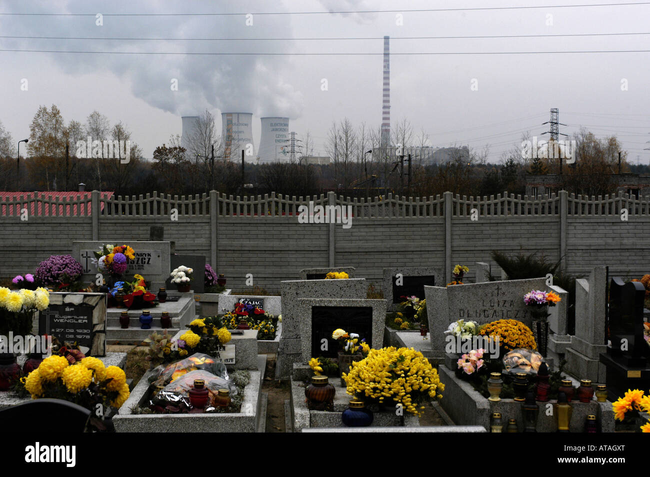 Graves on a cemetery and a power plant near Katowice, Poland Stock Photo