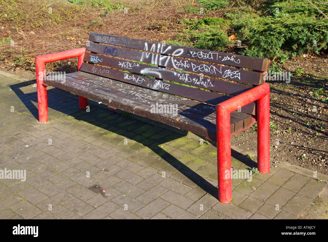 Essex Graffitti spray painted onto bench seat Stock Photo Alamy