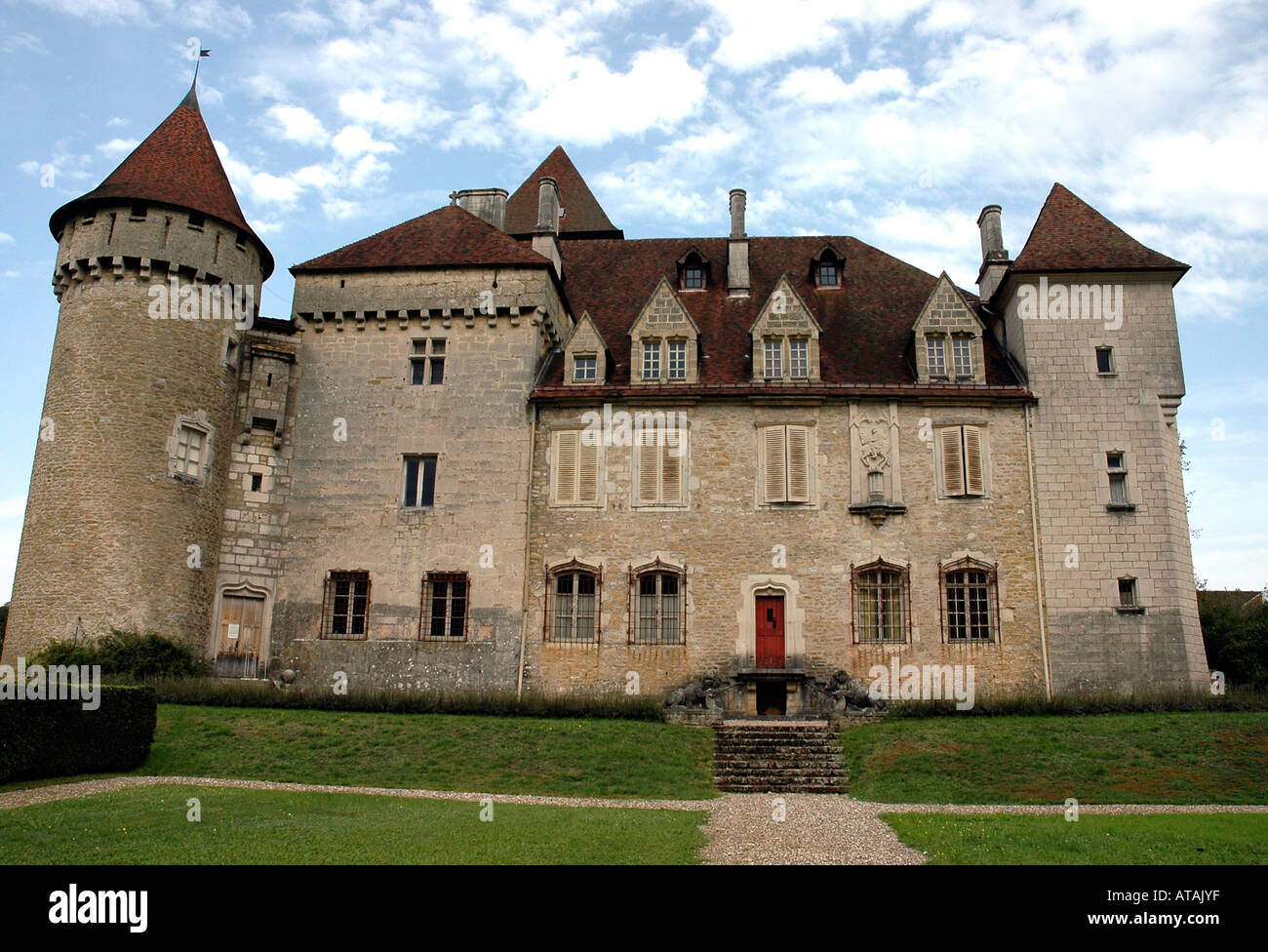 Set beside the Loue river in France's Jura region, the Château de Cléron, 14th-century restored,, viewed from its garden Stock Photo