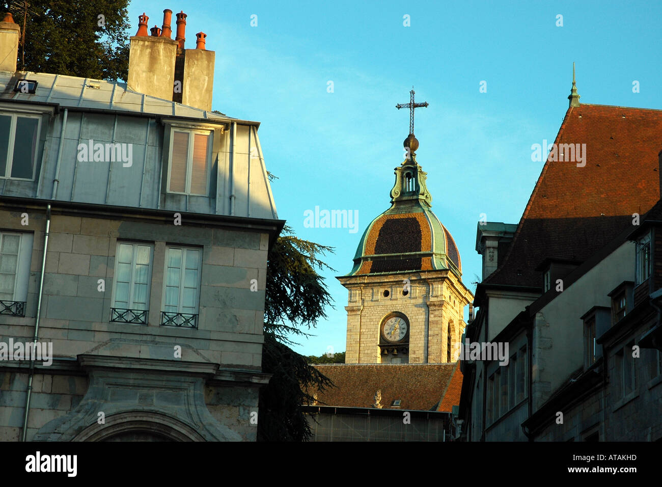 Shining tiles top the clocktower of Besançon's  St-Jean cathedral seen from the city's Grande Rue Stock Photo