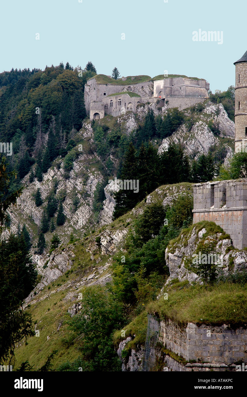 Part of the ruined Château de Joux on a high escarpment overlooking Pontarlier in France's Jura region Stock Photo