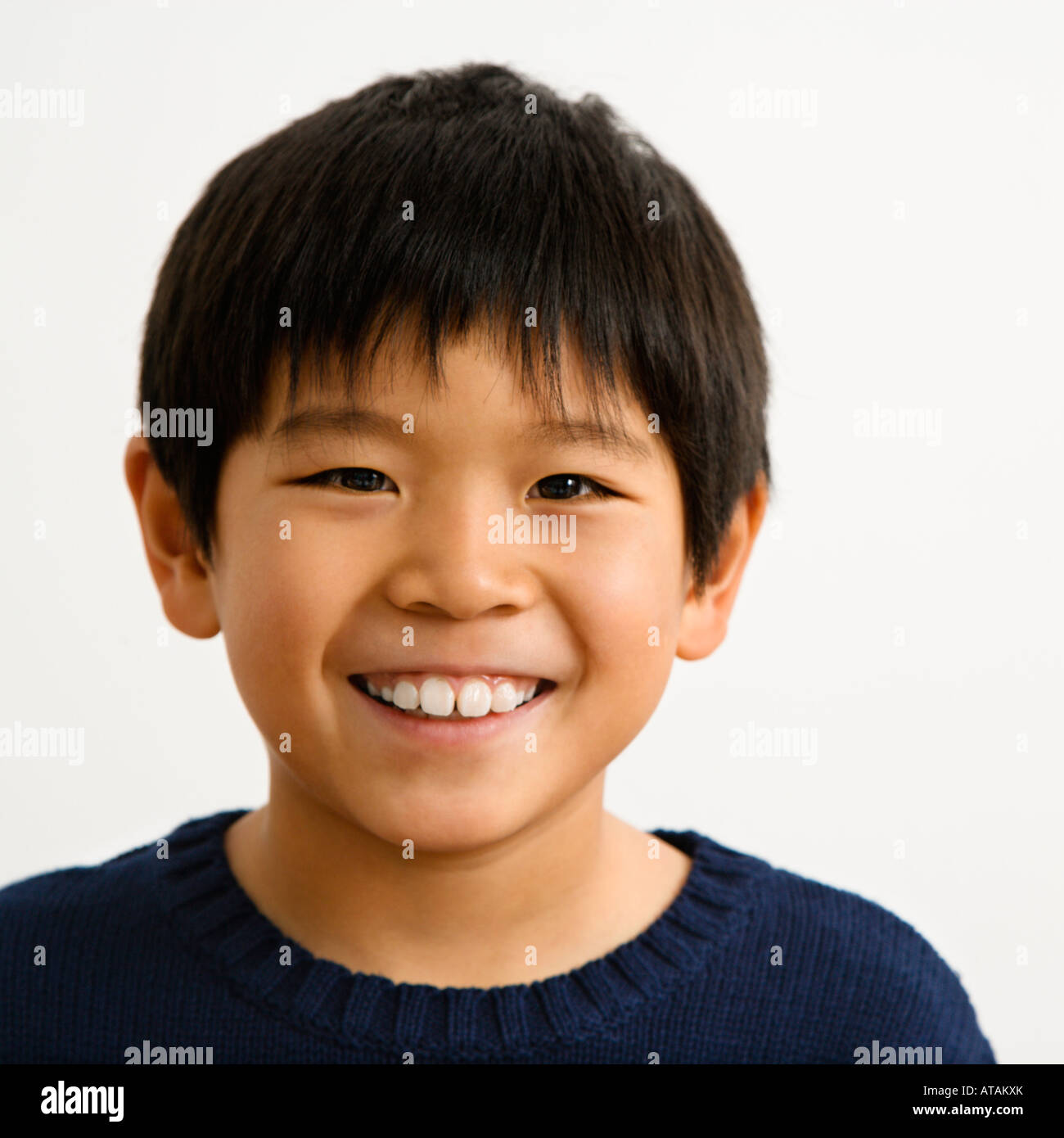 Portrait of young Asian boy smiling Stock Photo