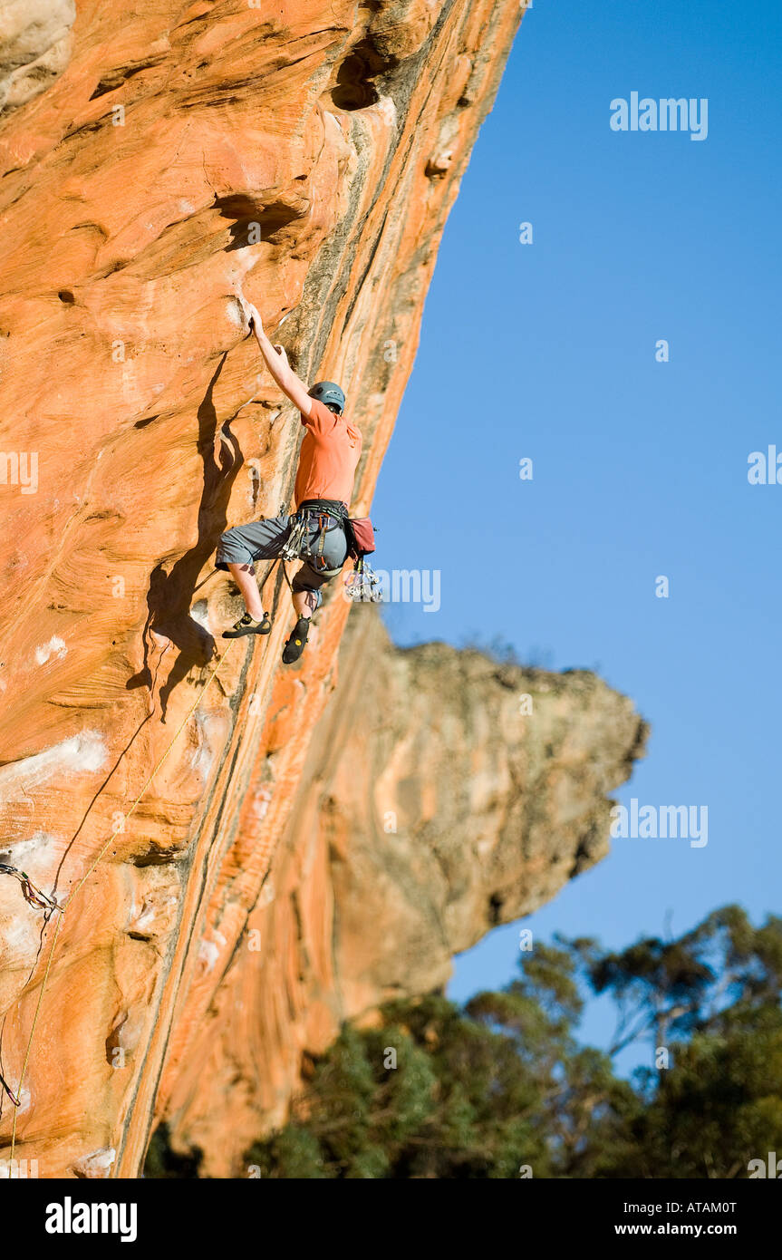 Damien Hall climbing the first pitch of Mr Joshua 25 on Tiapan Wall THe Grampians Victoria Stock Photo
