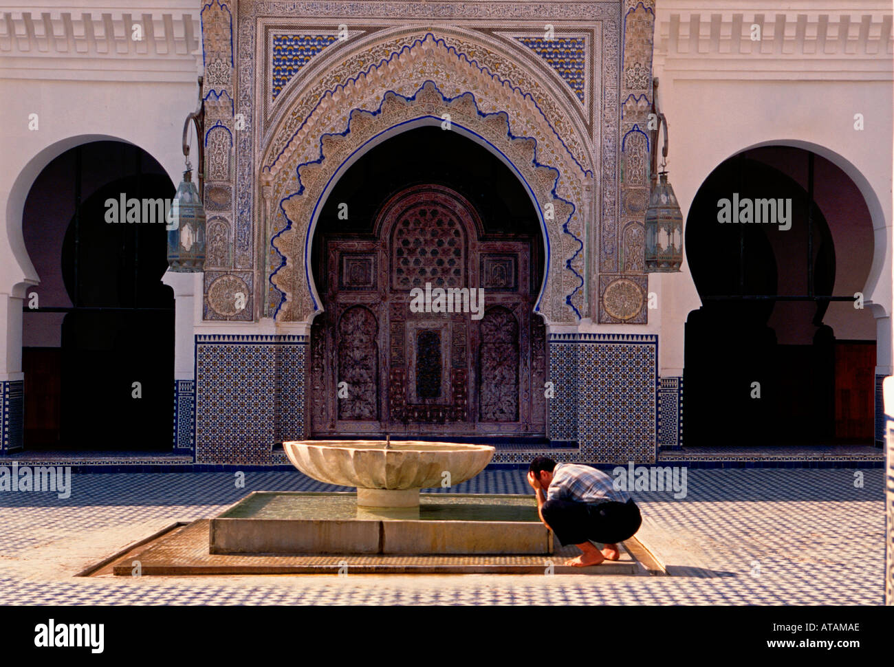 Moroccan man washing in water fountain, Moroccan man, washing, water