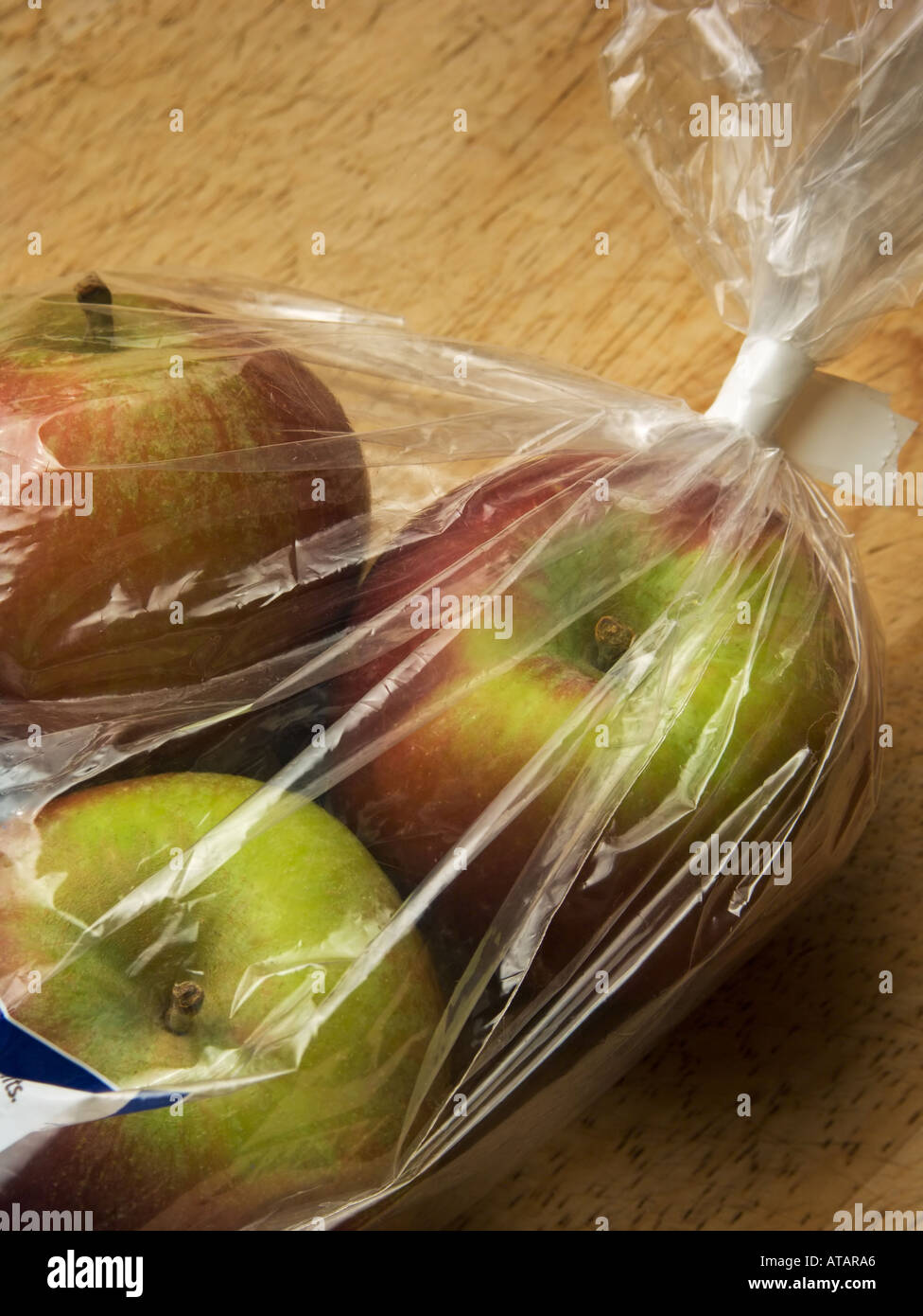 Plastic bag of apples Stock Photo - Alamy