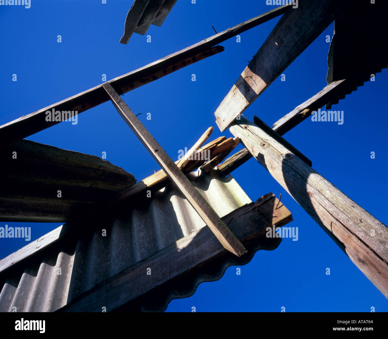 Abstract image of a broken down shed, under a deep blue sky. Stock Photo