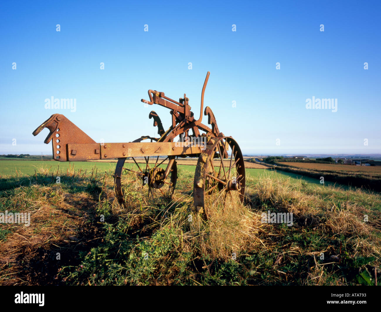 Rusty old plough, North Cornwall, England, UK Stock Photo