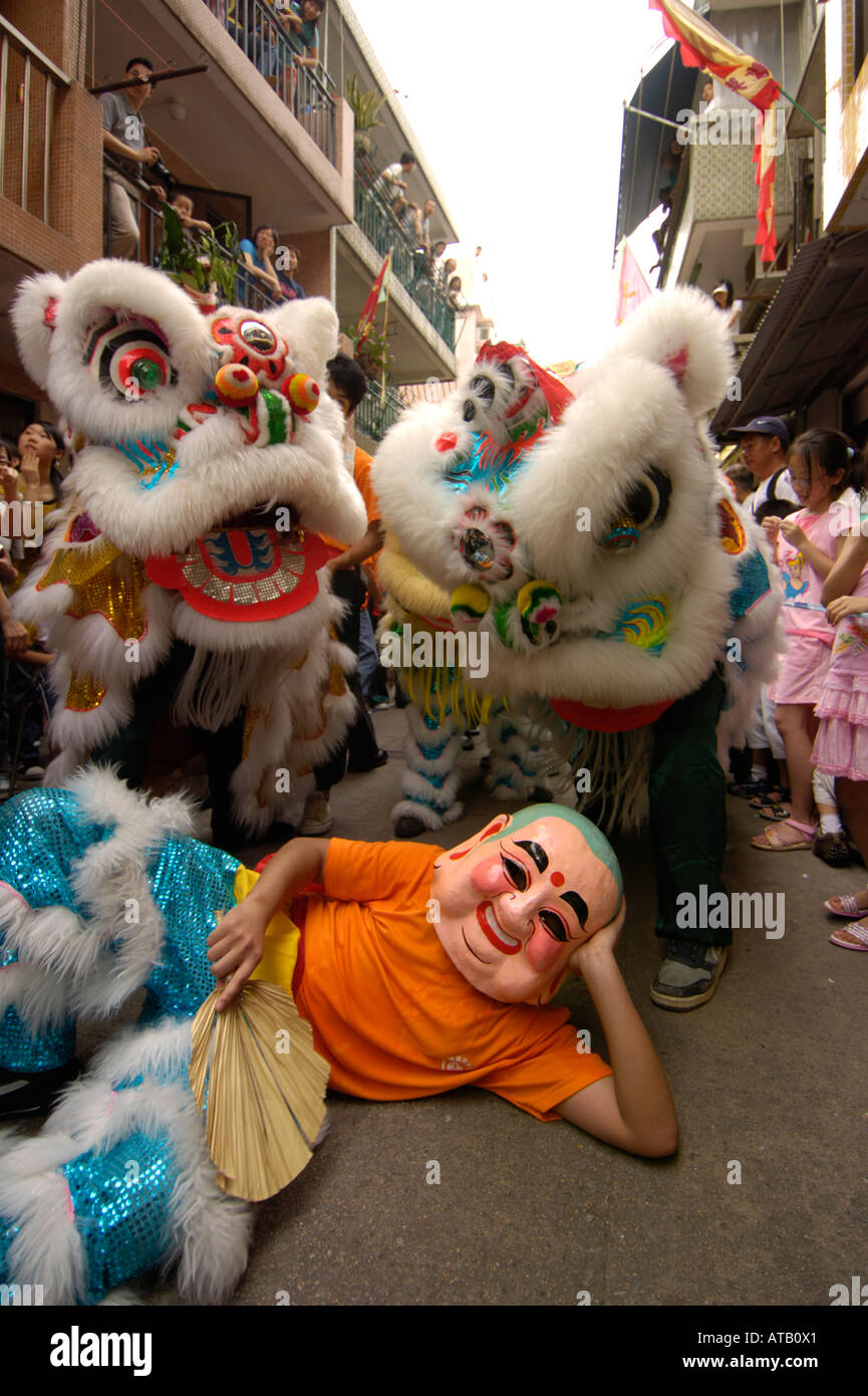 Masked dancer and Chinese lions at the 2006 Bun Festival Cheung Chau