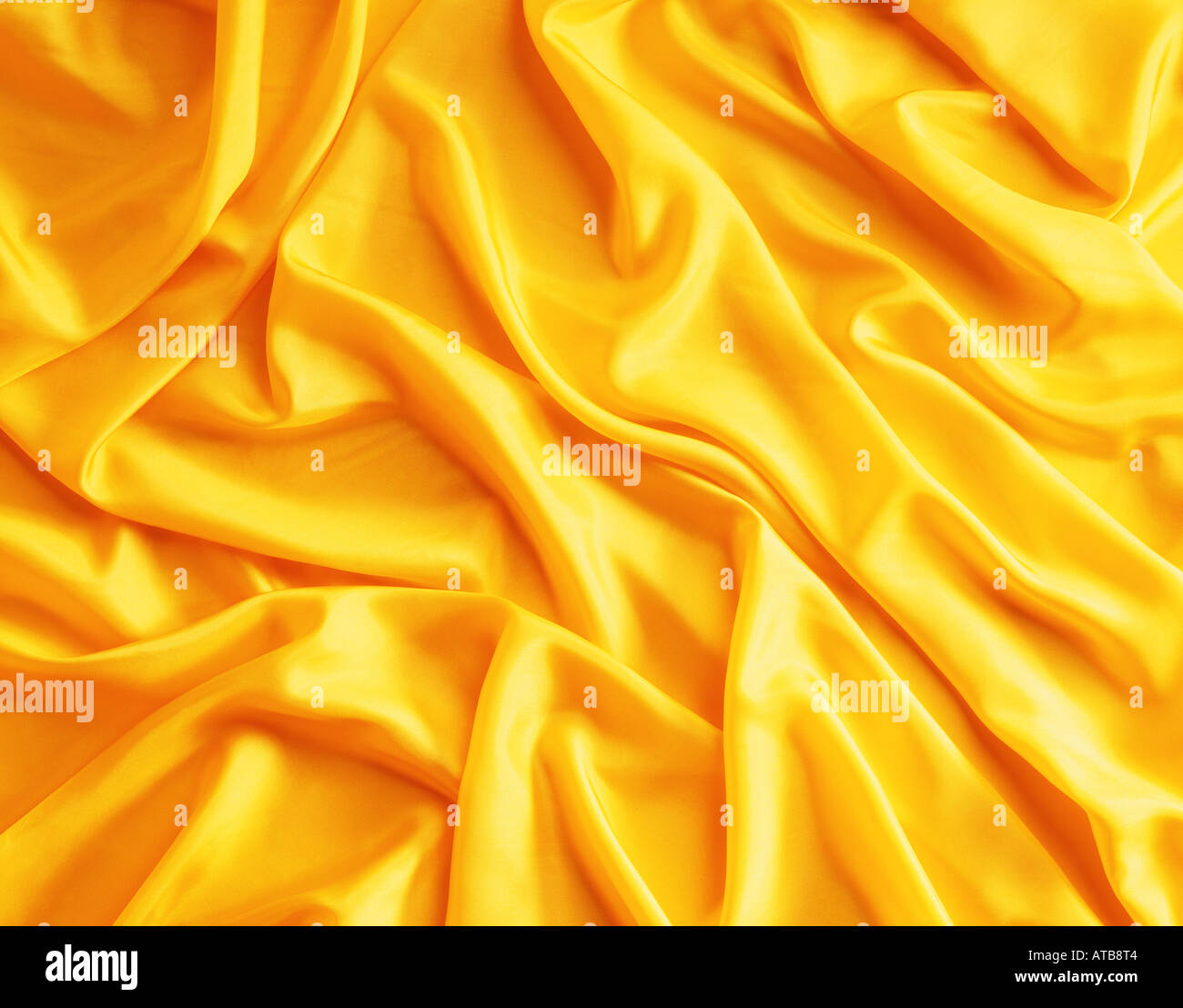 Yellow coloured silk fabric Stock Photo