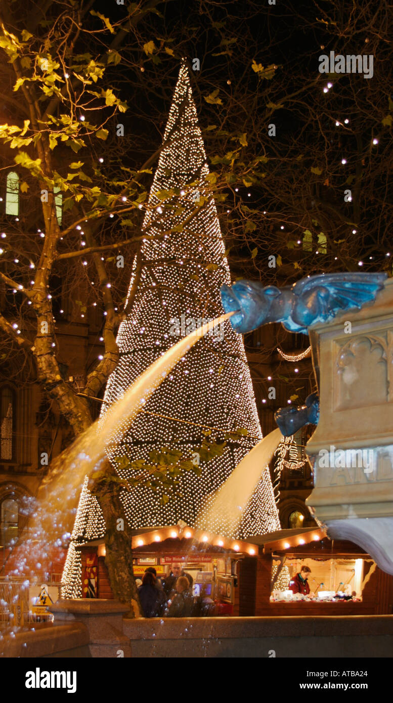 Christmas in Albert Square, Manchester. A Christmas Tree and the Victoria Jubilee Fountain Stock