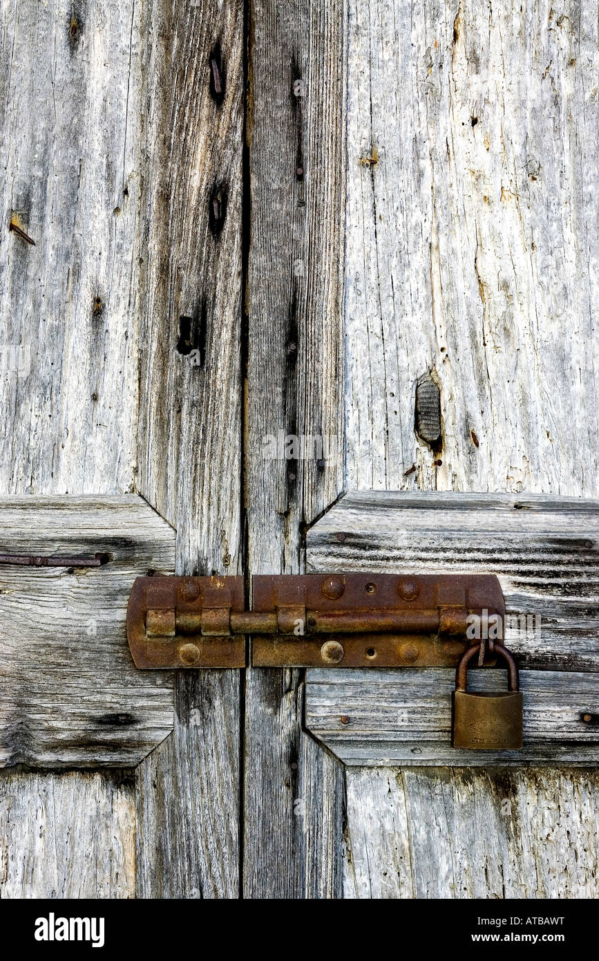 Old wooden door with a rusty padlock Stock Photo - Alamy