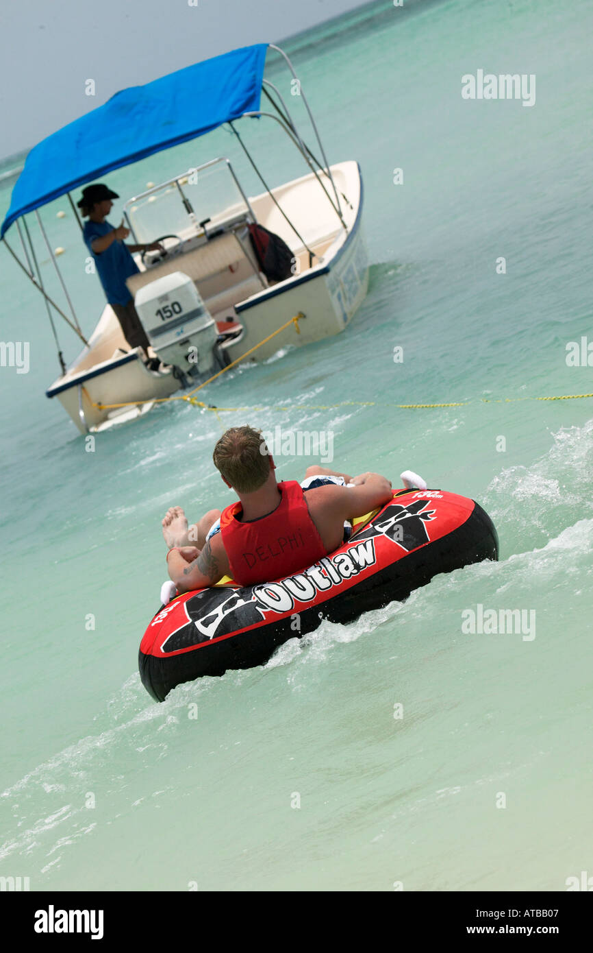 Tube ride behind boat Stock Photo Alamy