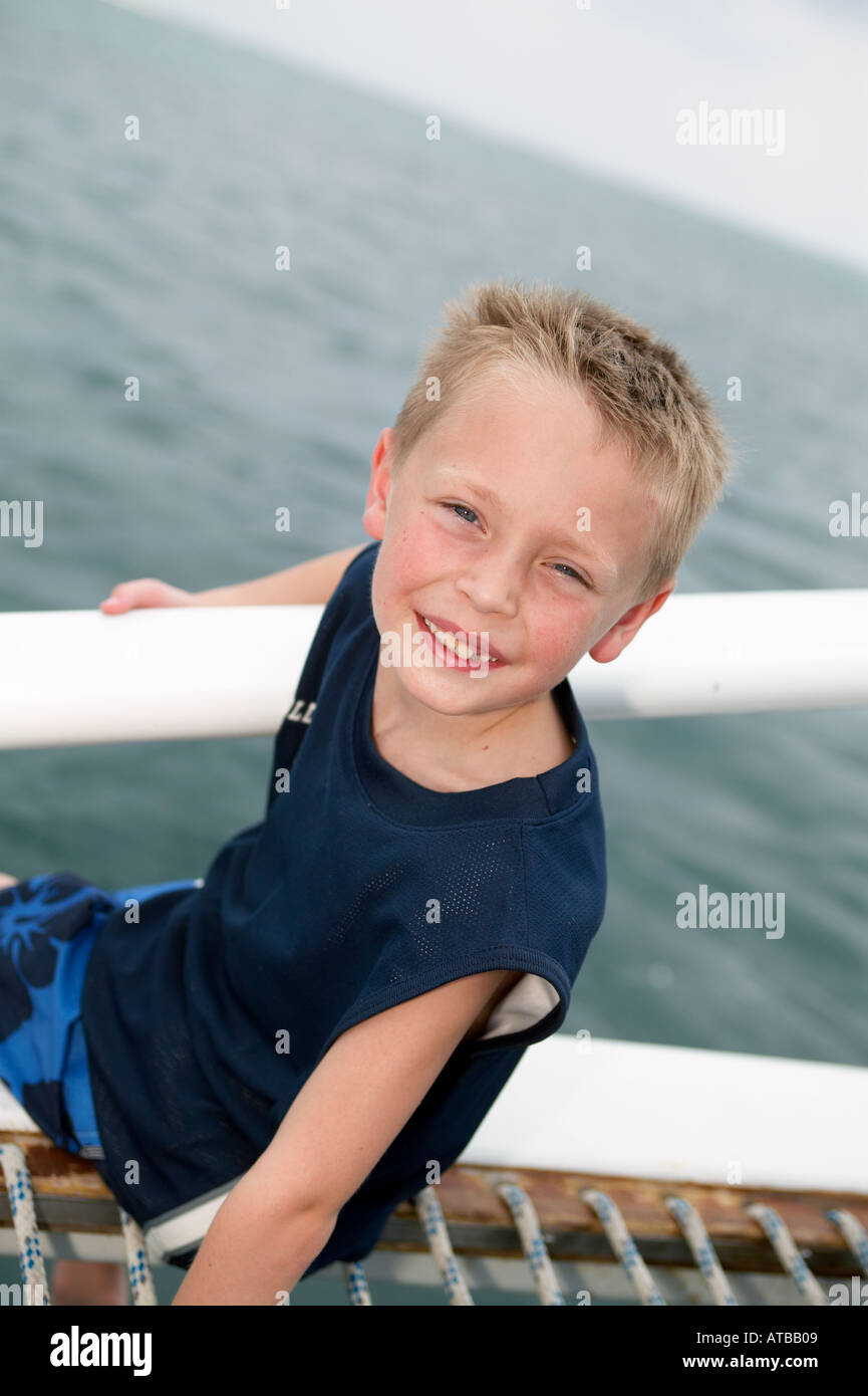 Boy on Catamaran netting Stock Photo