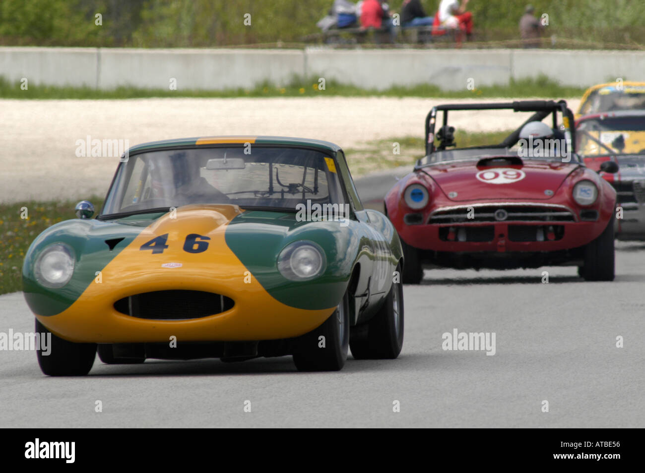 George Stauffer races his 1963 Jaguar XK E at the SVRA Vintage GT Challenge at Road America 2004 as a Sunbeam Tiger follows Stock Photo