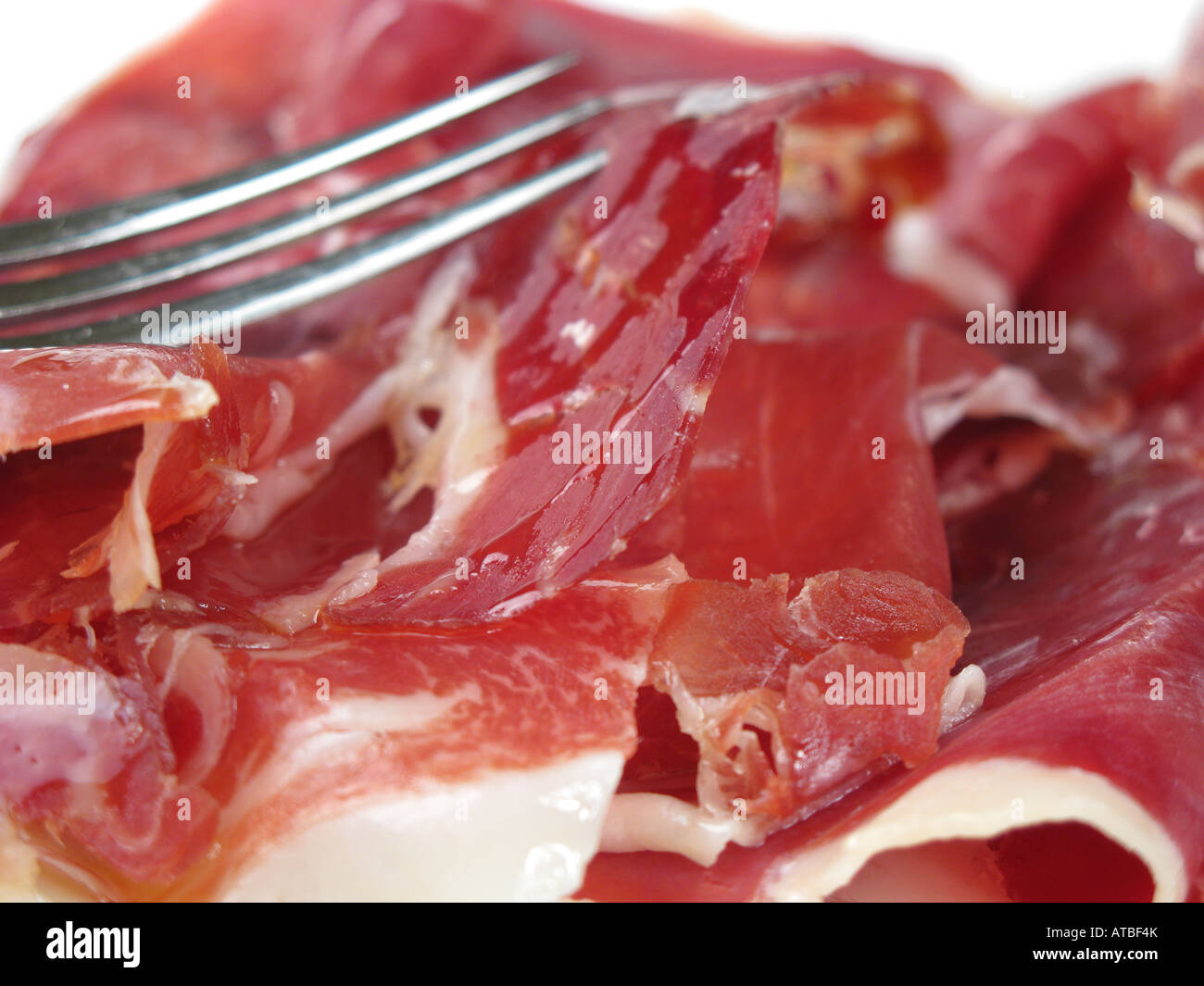 A close-up image of thinly-sliced Spanish gourmet aged Jamon Iberico de Bellota, showing rich colour and marbling. 2008. Stock Photo