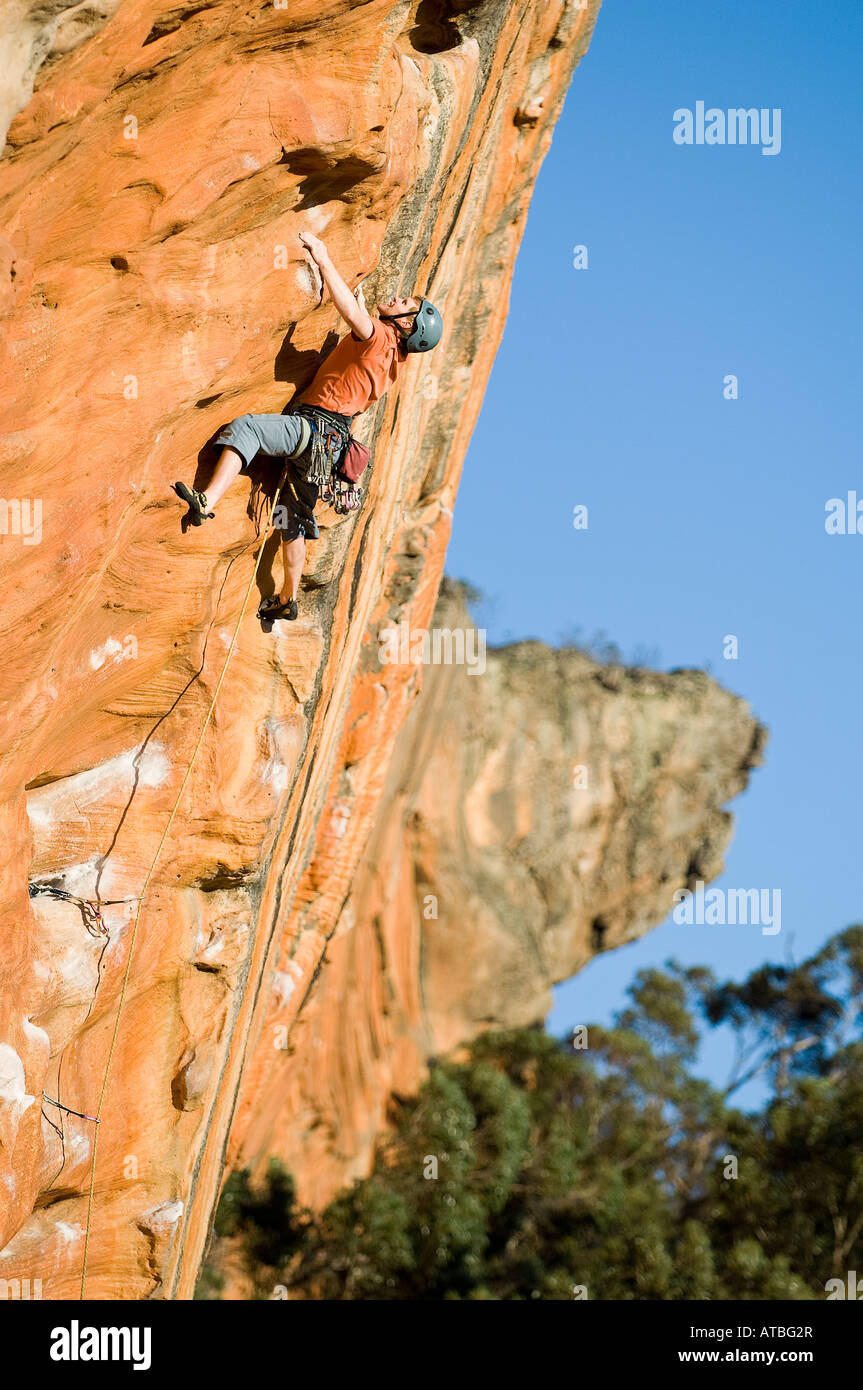 Damien Hall climbing the first pitch of Mr Joshua 25 on Tiapan Wall The Grampians Victoria Stock Photo