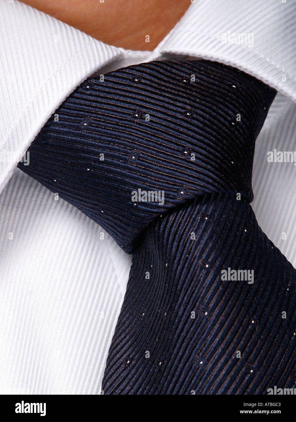 Closeup of tie knot on white shirt part of the businessmans uniform Stock  Photo - Alamy