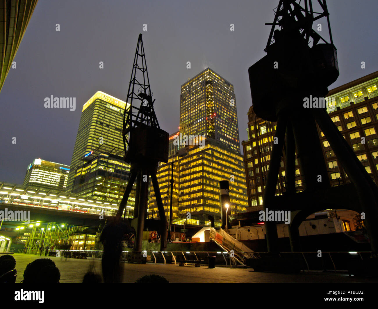 Office buildings and historic cranes Docklands Canary Wharf London UK ...