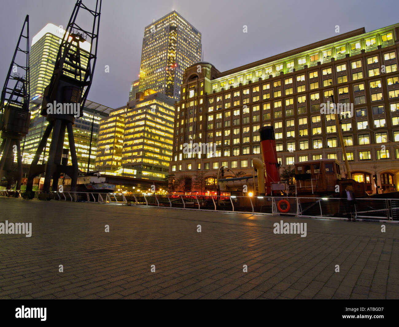 Office buildings and historic cranes Docklands Canary Wharf London UK ...
