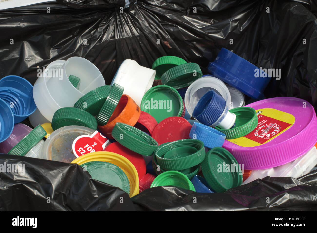 Plastic bottle tops in a recycling bin Stock Photo Alamy