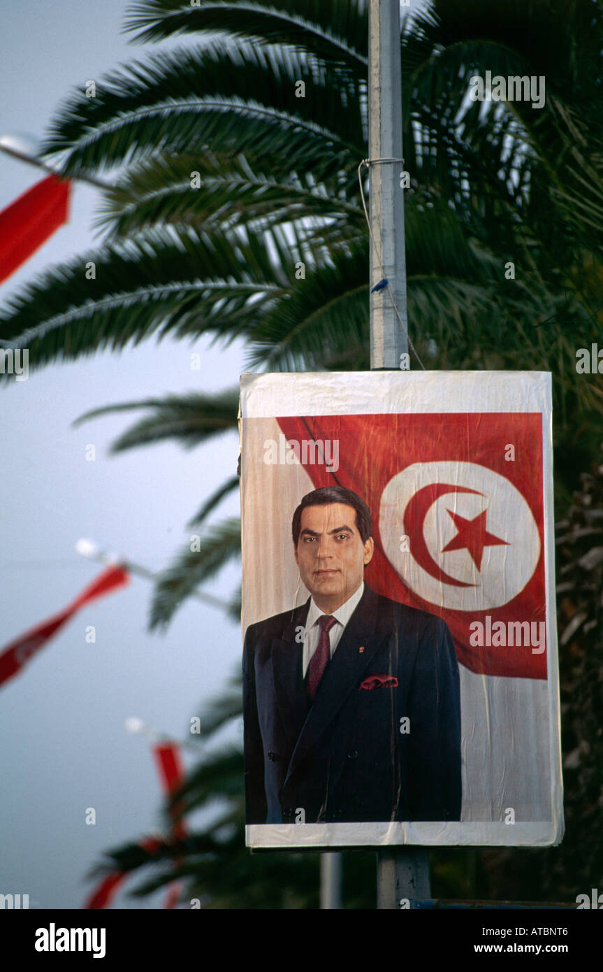 A bold political poster featuring President Ben Ali elected in 1987 and unopposed in the 1989 and 1994 elections attached to a hoarding on Ave Mohammed V in the city of Tunis Stock Photo