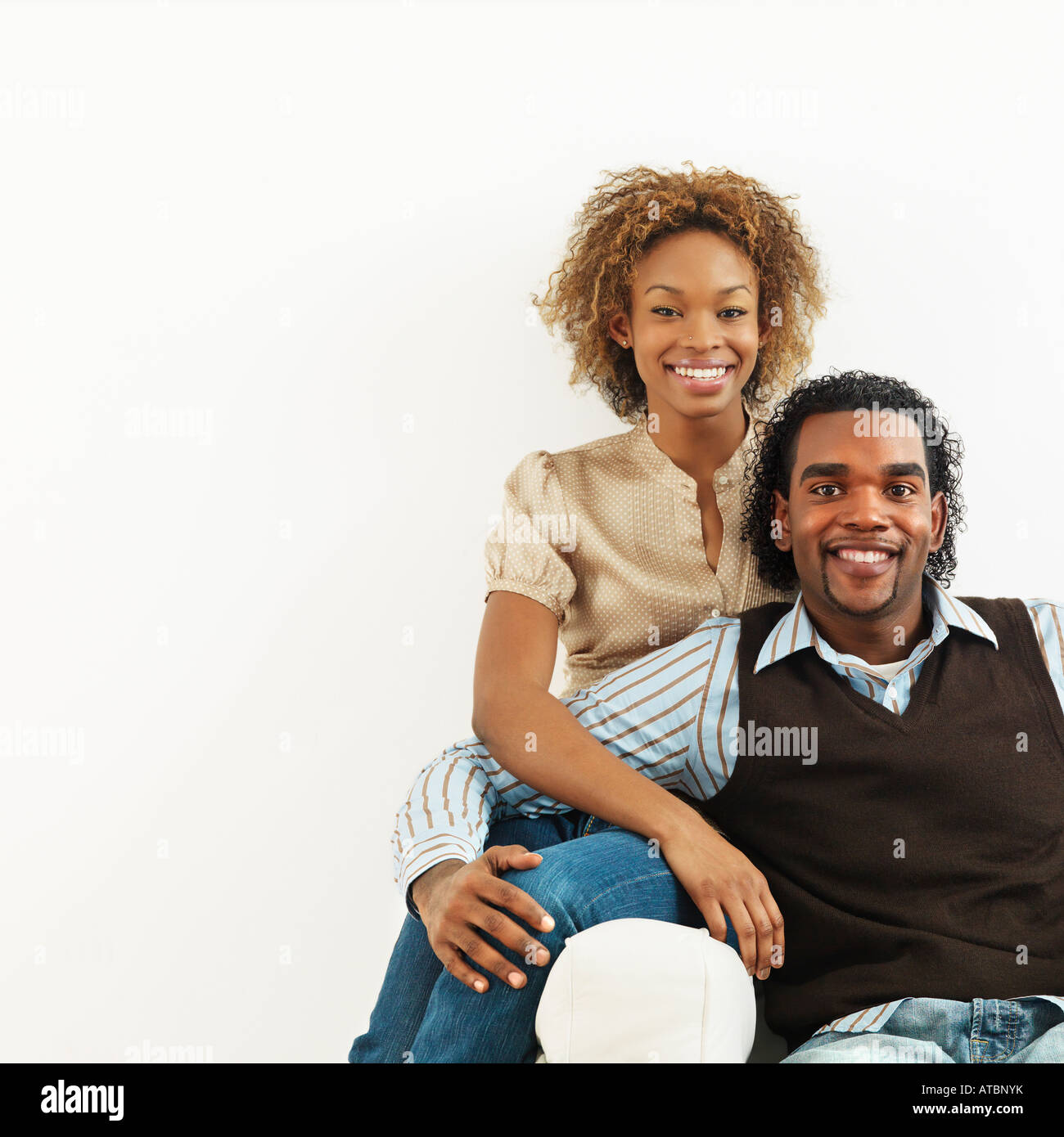Portrait of an happy African American couple standing with roadmap and ...