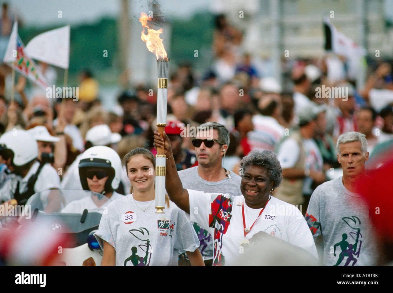 Woman carrying the Olympic torch before the 1996 Olympics St Augustine Florida USA Stock Photo