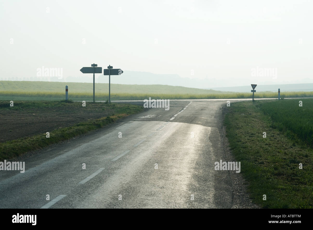 Forked road in countryside Stock Photo